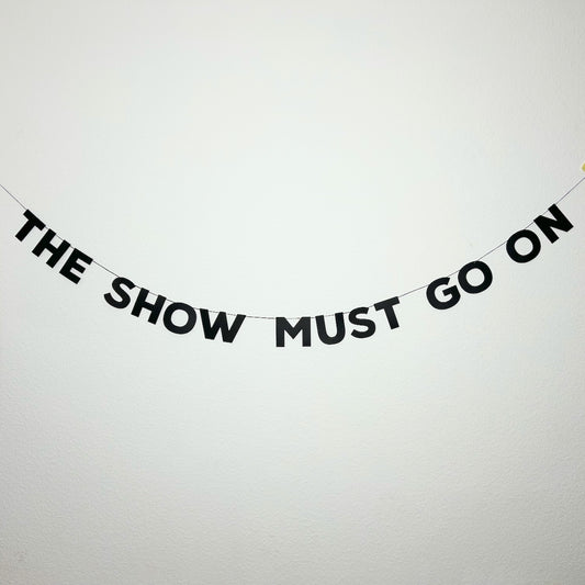 THE SHOW MUST GO ON